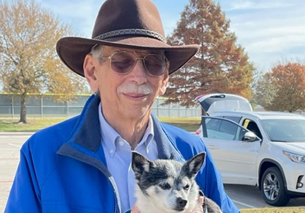Image of donor David Sward holding his dog